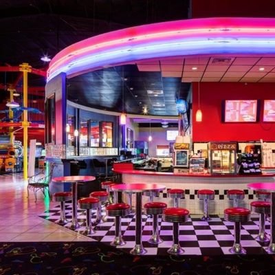 Food and drinks seating area inside Alley Arcade entertainment center in Cambridge New Zealand