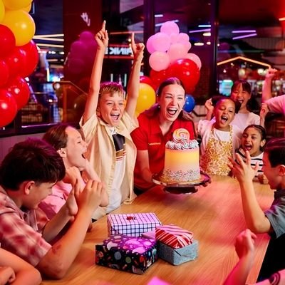 Children enjoying a birthday party with balloons and cake in Cambridge New Zealand